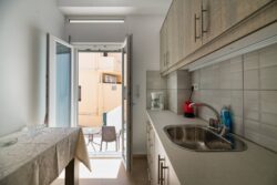 Irini apartments, the kitchen and the side entrance
